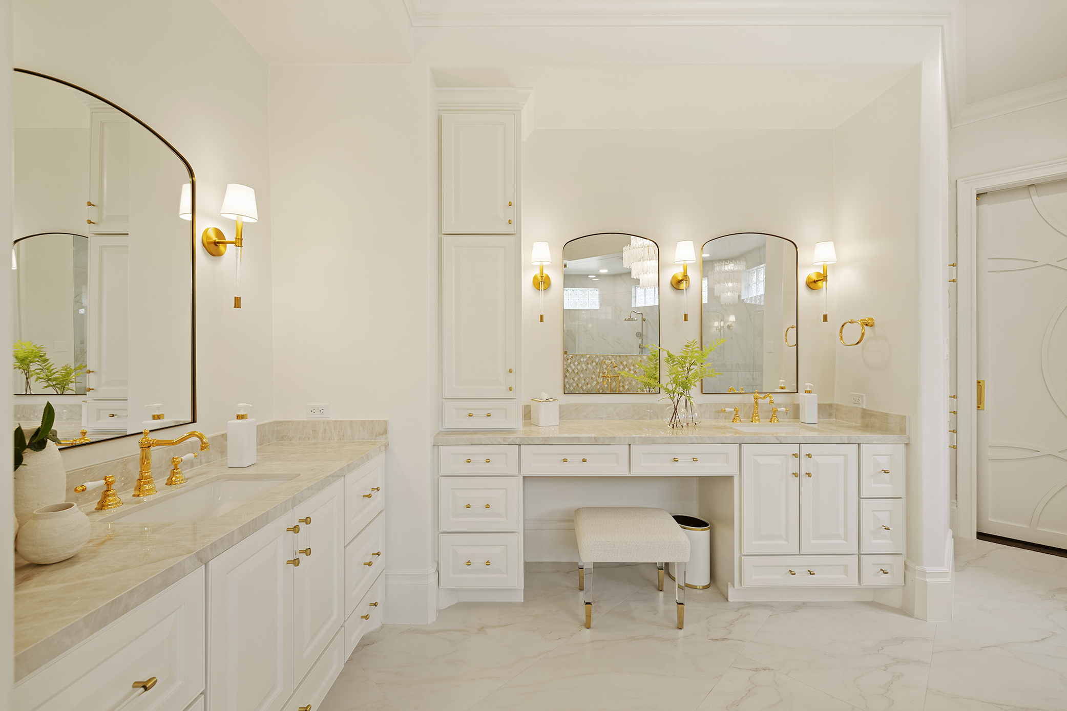 Modern white bathroom with gold accents